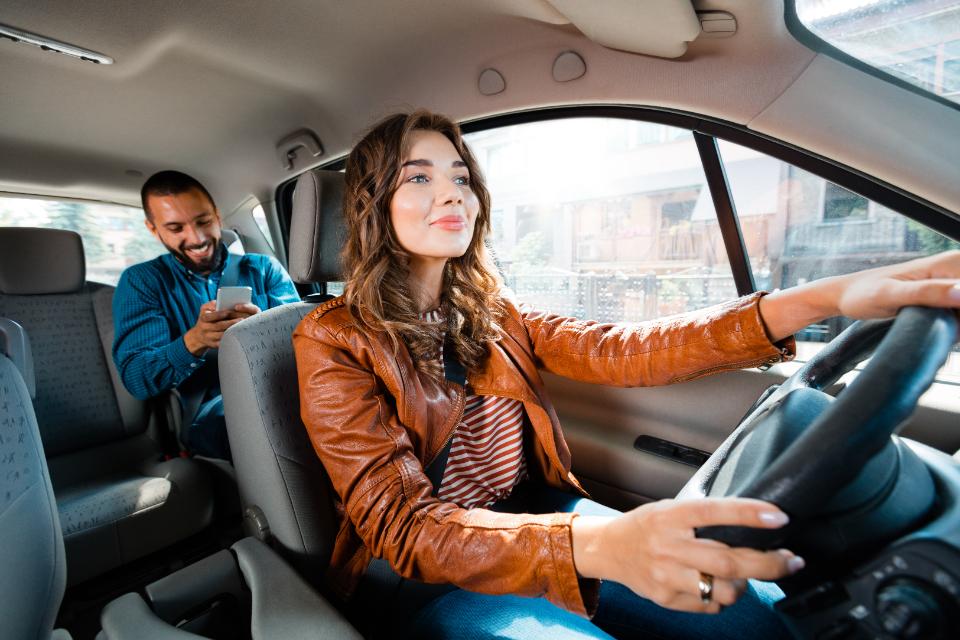 Taxi driver taking passenger to his destination